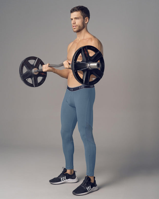 Licra deportiva en microfibra con mallas transpirables para hombre#color_544-azul-grisaceo